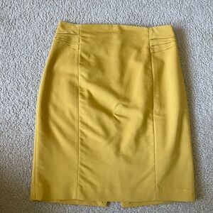 Express, size 6, women’s midi skirt in yellow.
